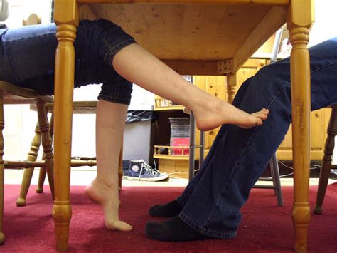 Show more. . Footjob under the table